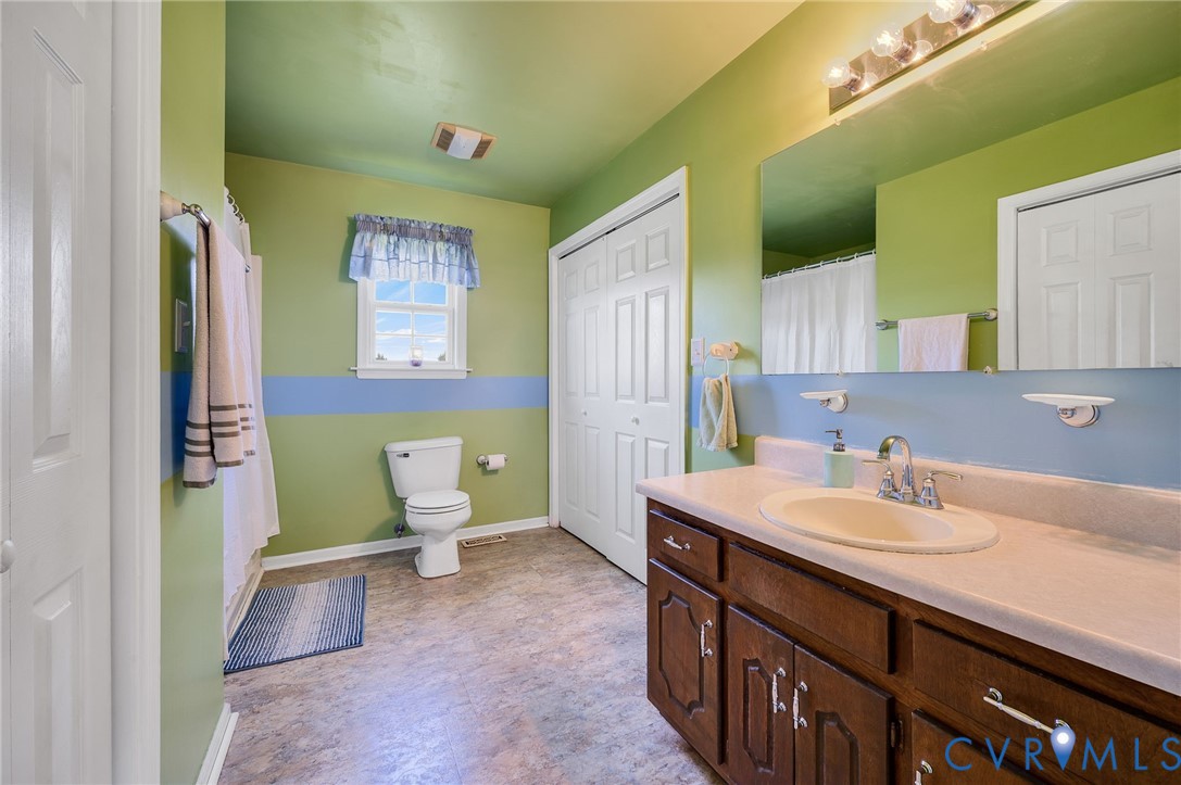 5280 West Quaker Road Disputanta, VA 23875 - Photo 29 of 33 a bathroom with a sink and a mirror