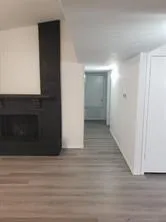 a view of hallway with wooden floor