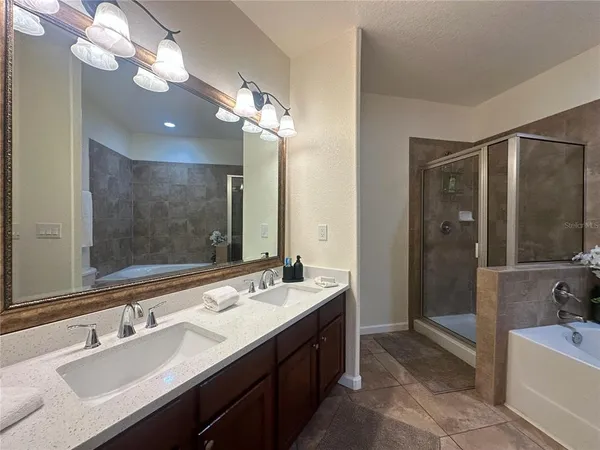 a bedroom with a bed and a television