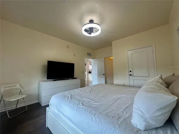 a bathroom with a sink toilet a mirror and shower