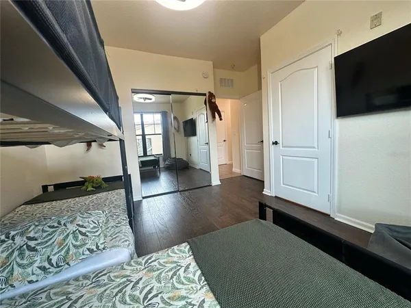 a view of a livingroom with furniture and a flat screen tv