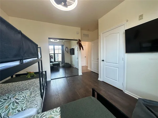 a large kitchen with lots of counter space a sink appliances and living room view