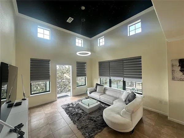 a view of a house with swimming pool and porch