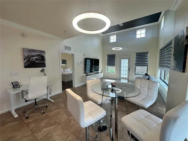 a view of a house with swimming pool having outdoor seating