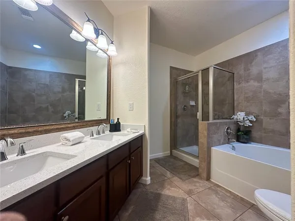 a view of a house with backyard porch and sitting area