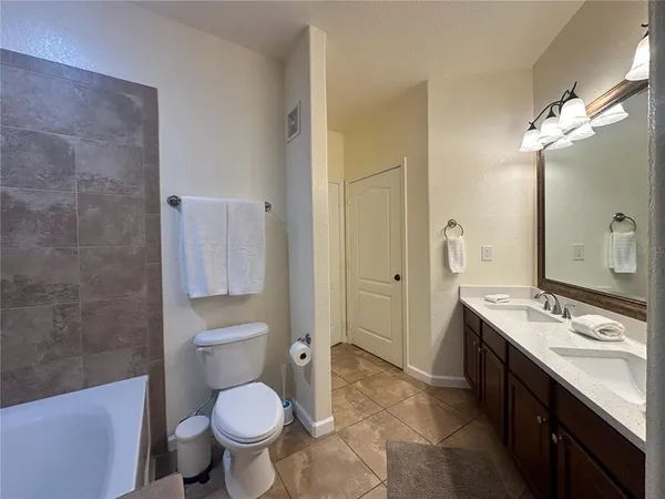 a view of a livingroom with furniture and a floor to ceiling window