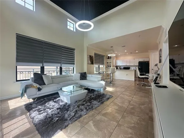a view of a patio with a table chairs and a backyard