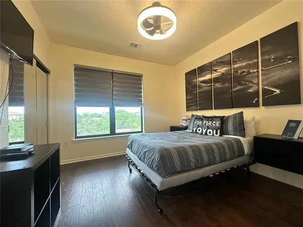 a bathroom with a double vanity sink toilet and a mirror