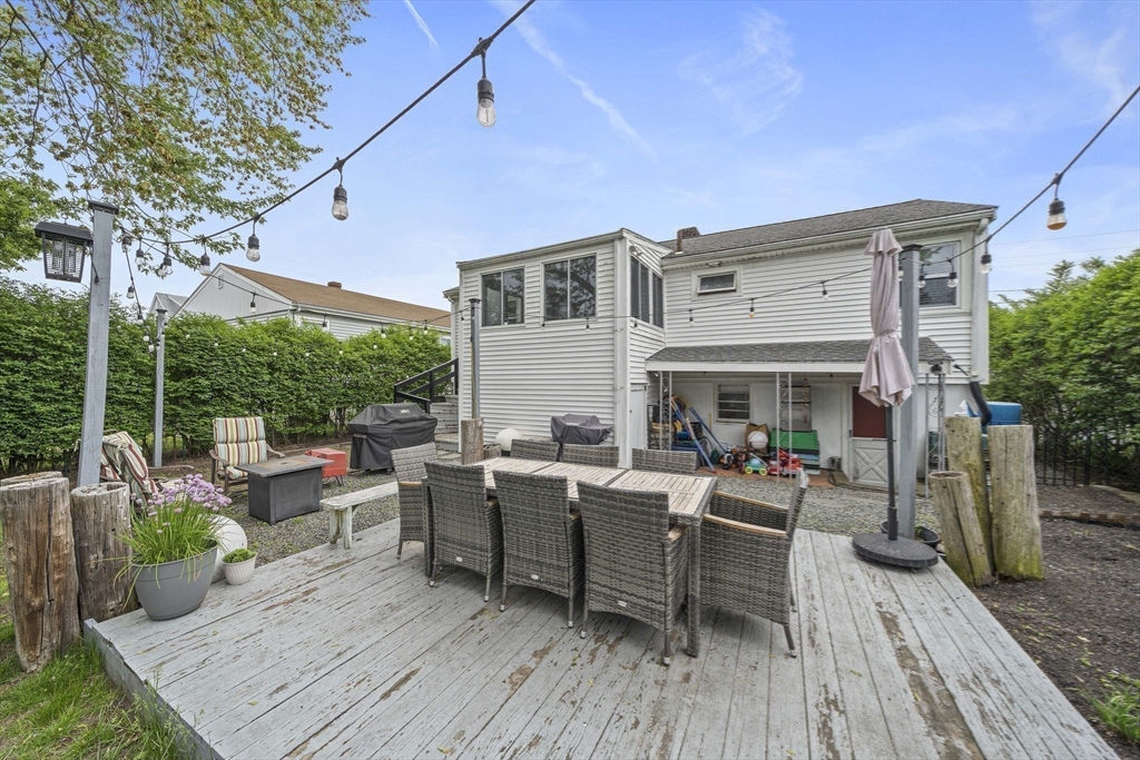 15 D Street Hull, MA 02045 - Photo 28 of 42 a view of a house with backyard sitting area and garden