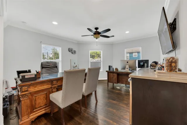 a view of a dining room with furniture and wooden floor