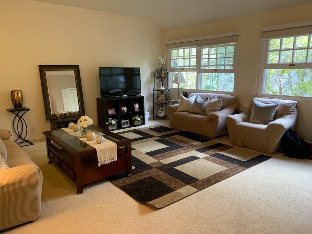 651235a Opelo Road, Unit 5 Kamuela, HI 96743 - Photo 2 of 5 a living room with furniture and a flat screen tv