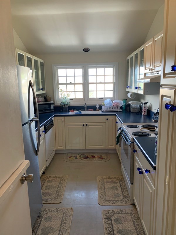 651235a Opelo Road, Unit 5 Kamuela, HI 96743 - Photo 3 of 5 a large kitchen with stainless steel appliances granite countertop a sink stove and refrigerator