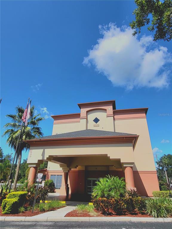 3000 Maingate Lane, Unit 517 Kissimmee, FL 34747 - Photo 1 of 13 front view of house with potted plants