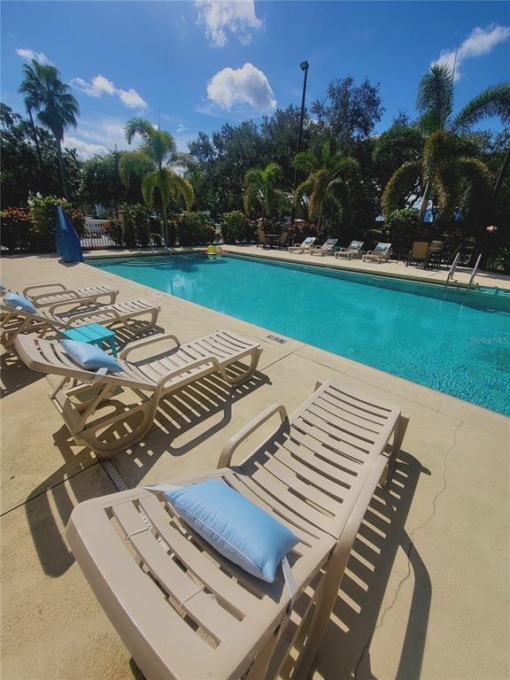 3000 Maingate Lane, Unit 517 Kissimmee, FL 34747 - Photo 11 of 13 a view of a backyard with sitting area