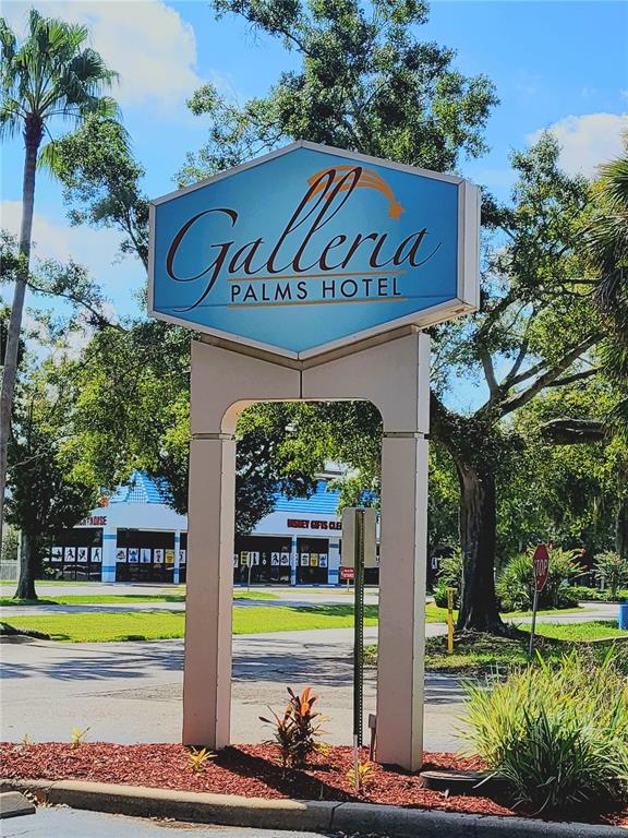 3000 Maingate Lane, Unit 517 Kissimmee, FL 34747 - Photo 2 of 13 a front view of a house with garden