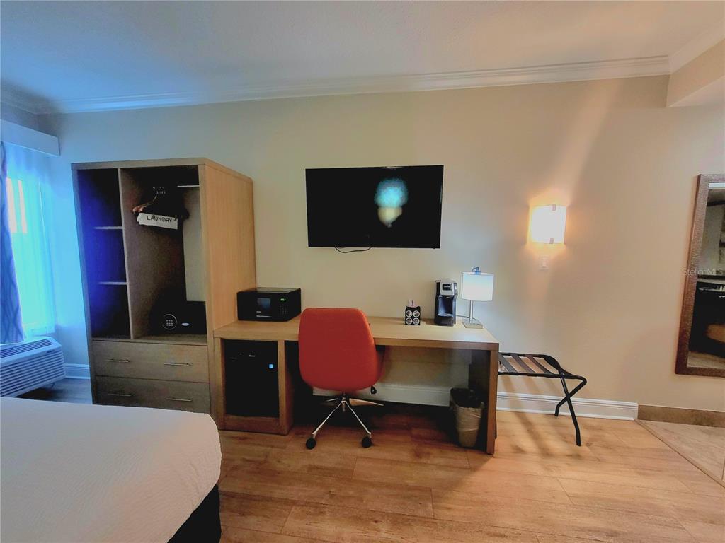 3000 Maingate Lane, Unit 517 Kissimmee, FL 34747 - Photo 7 of 13 a workspace with furniture and rug