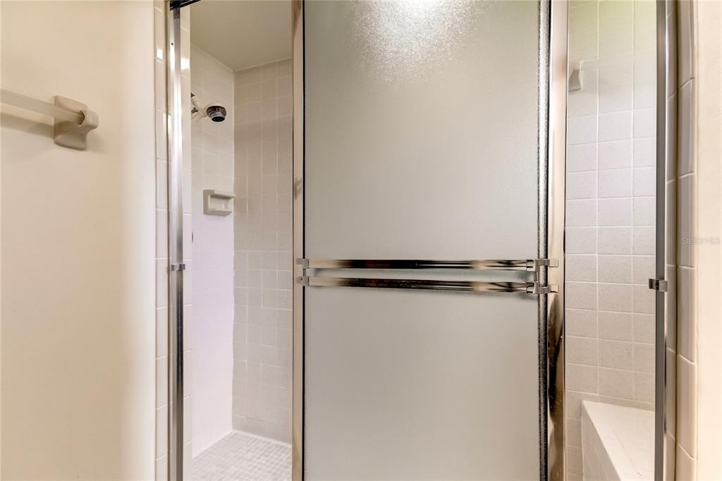 7438 Sheldrake Street New Port Richey, FL 34654 - Photo 21 of 29 MASTER SHOWER WITH BENCH