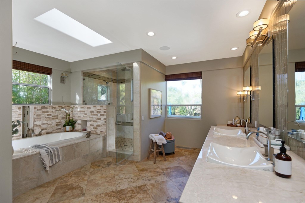 1264 Rancho Encinitas Drive Encinitas, CA 92024 - Photo 18 of 37 a living room with furniture and a large window
