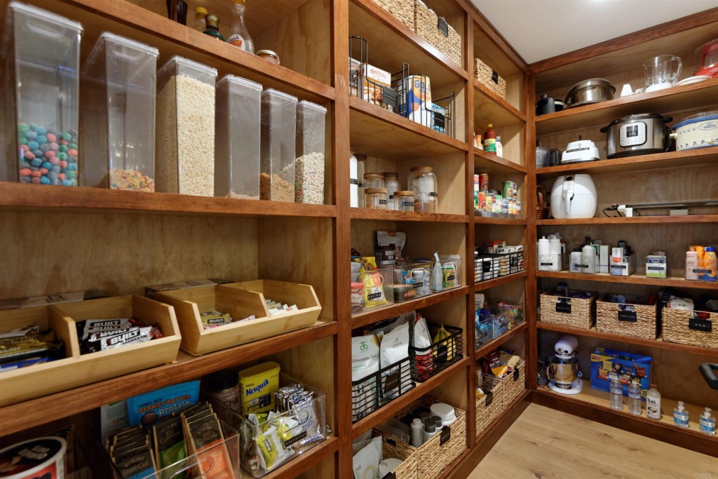1264 Rancho Encinitas Drive Encinitas, CA 92024 - Photo 21 of 37 a view of a book shelf in a shelf