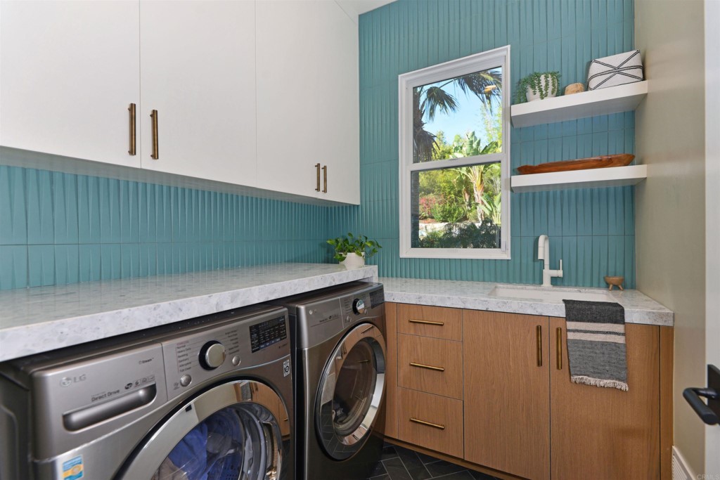 1264 Rancho Encinitas Drive Encinitas, CA 92024 - Photo 22 of 37 a utility room with dryer and washer