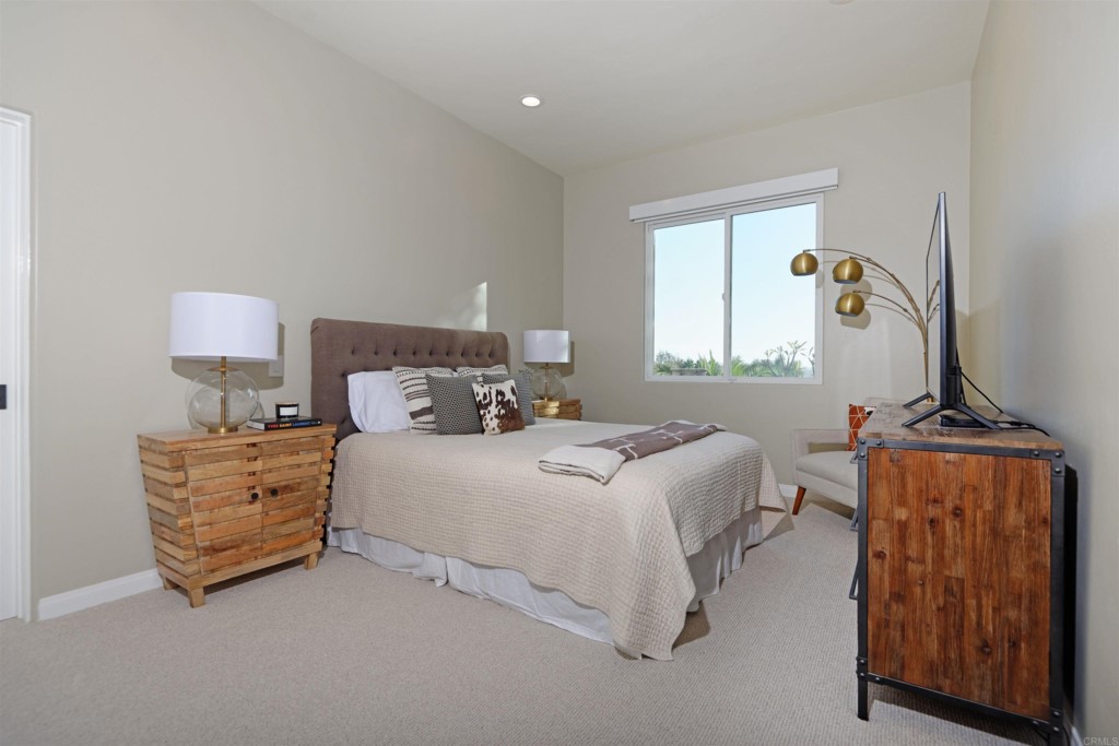 1264 Rancho Encinitas Drive Encinitas, CA 92024 - Photo 27 of 37 a bedroom with a bed and a dresser