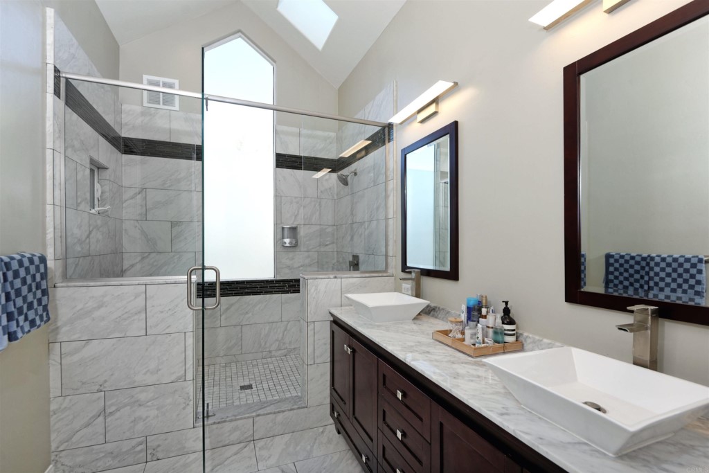 1264 Rancho Encinitas Drive Encinitas, CA 92024 - Photo 30 of 37 a bathroom with a granite countertop sink mirror and double