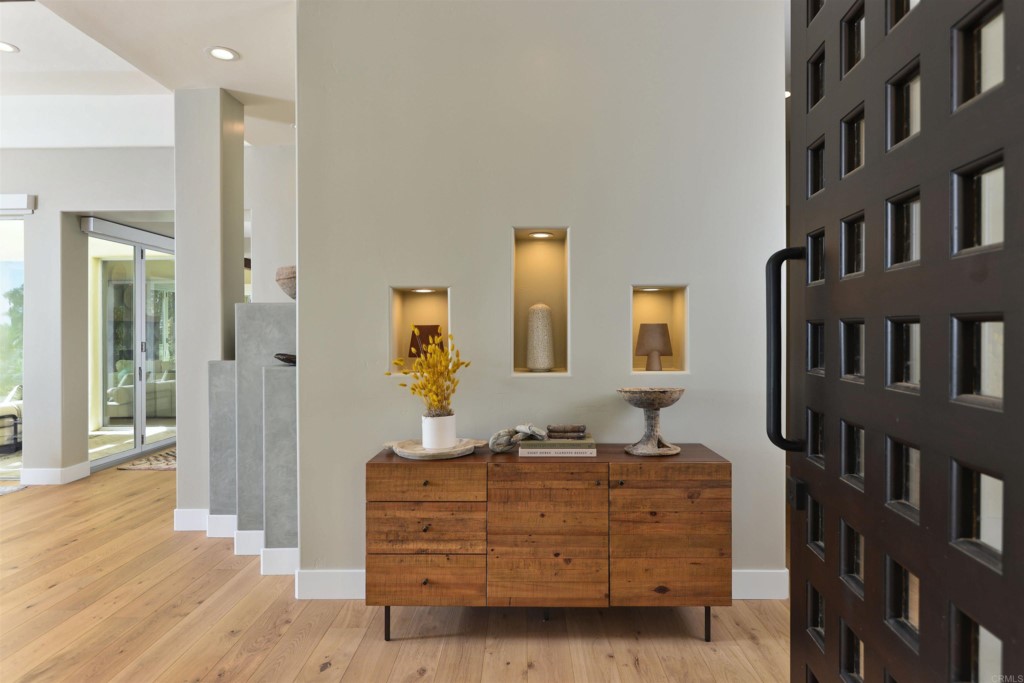 1264 Rancho Encinitas Drive Encinitas, CA 92024 - Photo 6 of 37 a room with a dresser and a mirror