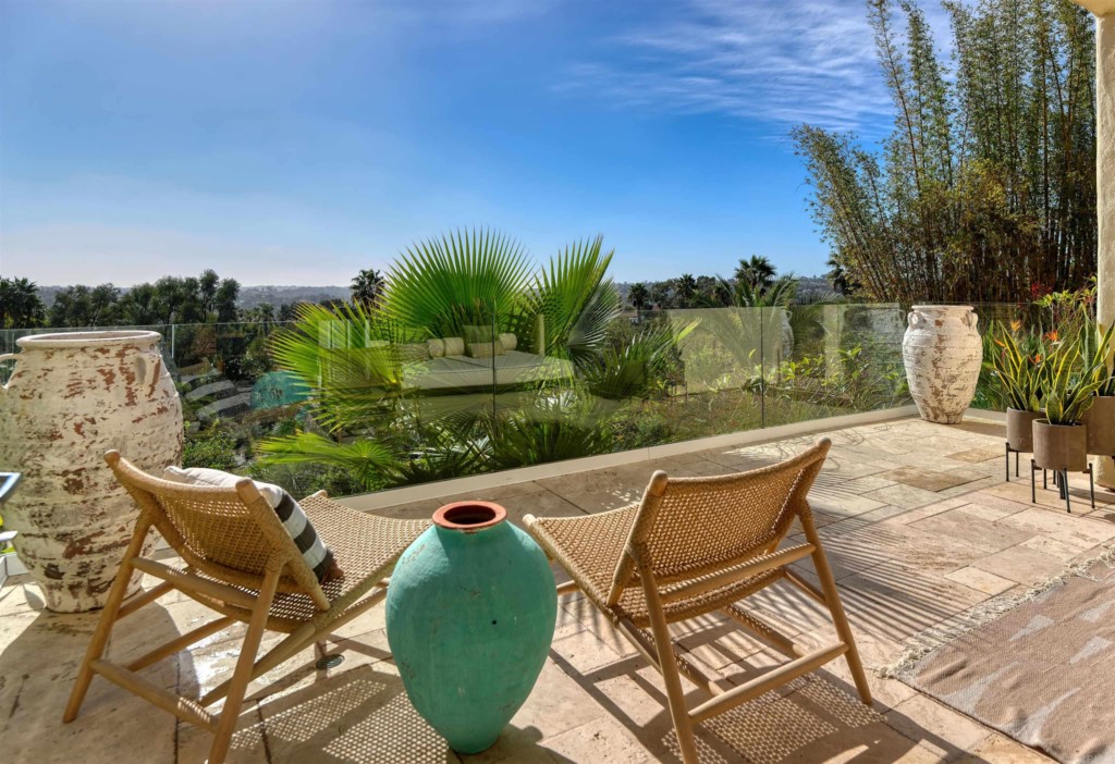 1264 Rancho Encinitas Drive Encinitas, CA 92024 - Photo 10 of 37 a view of a chairs and table in patio