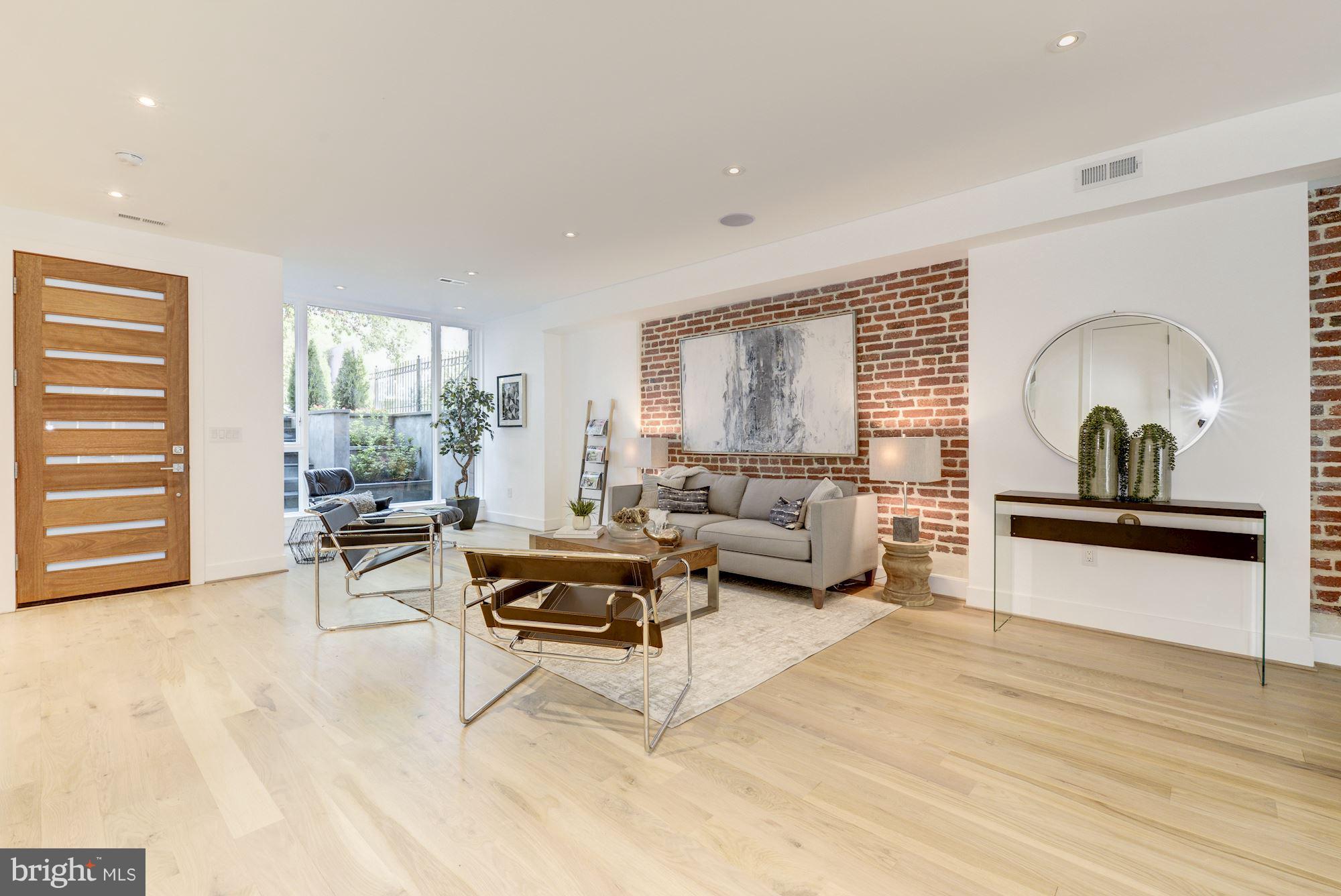 505 K Street Northeast, Unit 2 Washington, DC 20002 - Photo 2 of 18 a living room with furniture and a wooden floor