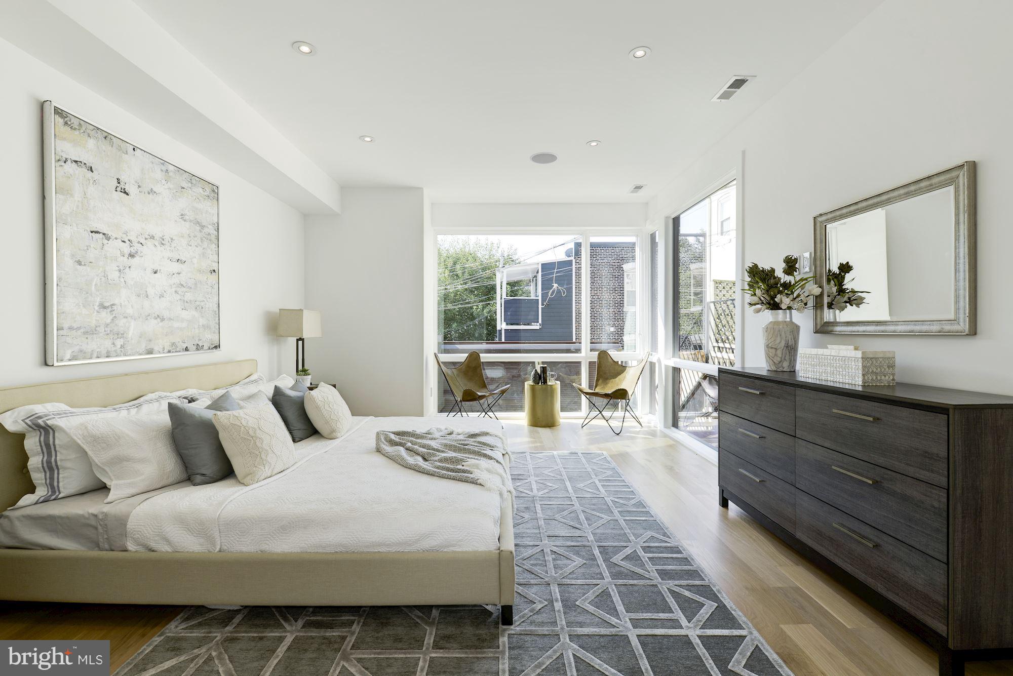 505 K Street Northeast, Unit 2 Washington, DC 20002 - Photo 11 of 18 a bedroom with a large bed and a couch