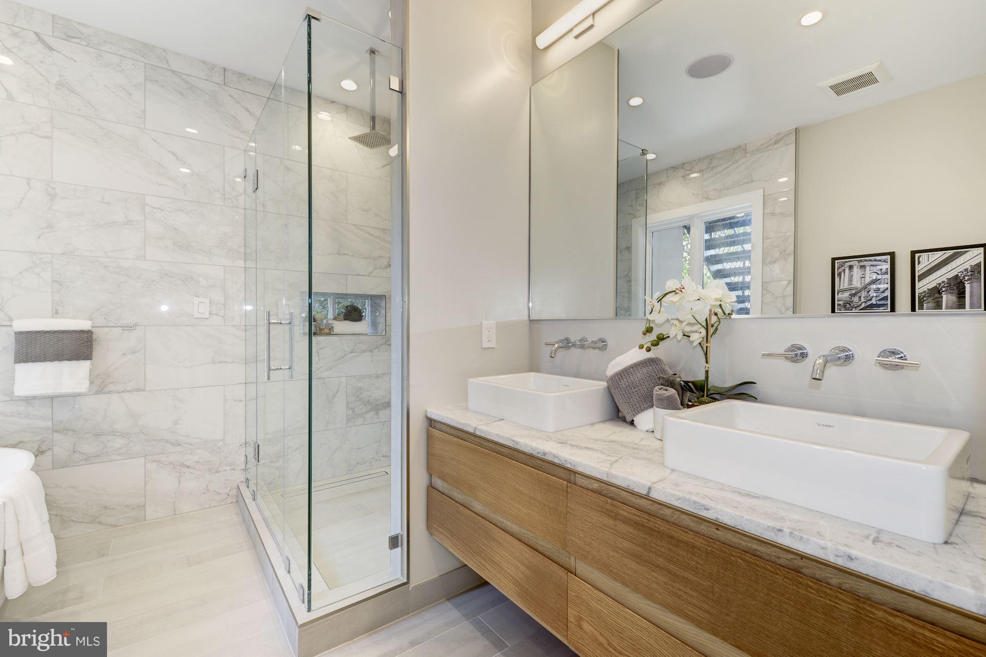 505 K Street Northeast, Unit 2 Washington, DC 20002 - Photo 12 of 18 a bathroom with a granite countertop sink mirror and shower