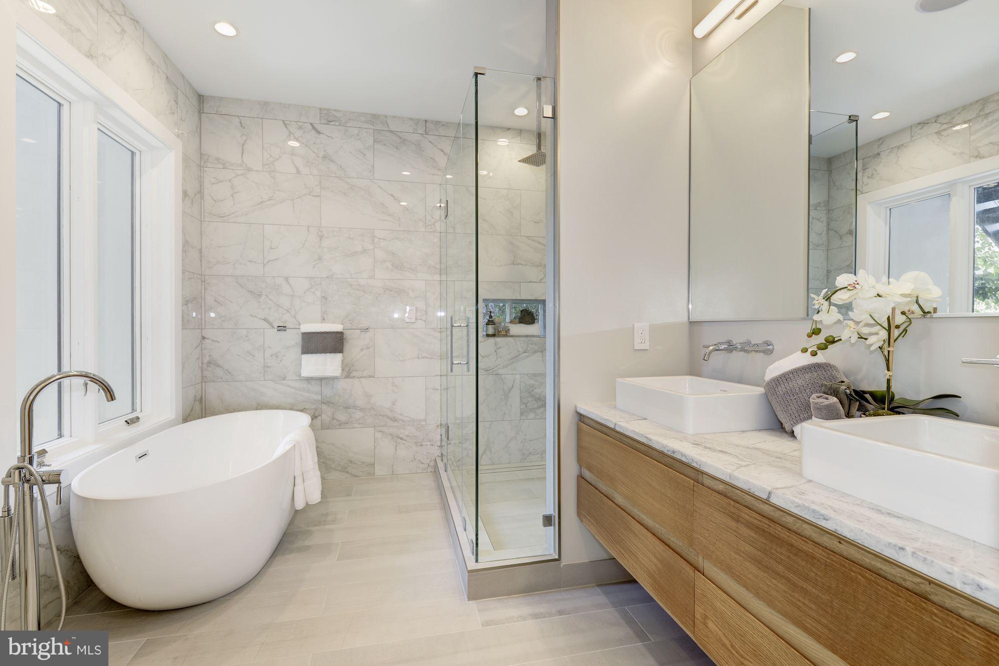 505 K Street Northeast, Unit 2 Washington, DC 20002 - Photo 13 of 18 a bathroom with a double vanity sink mirror and shower