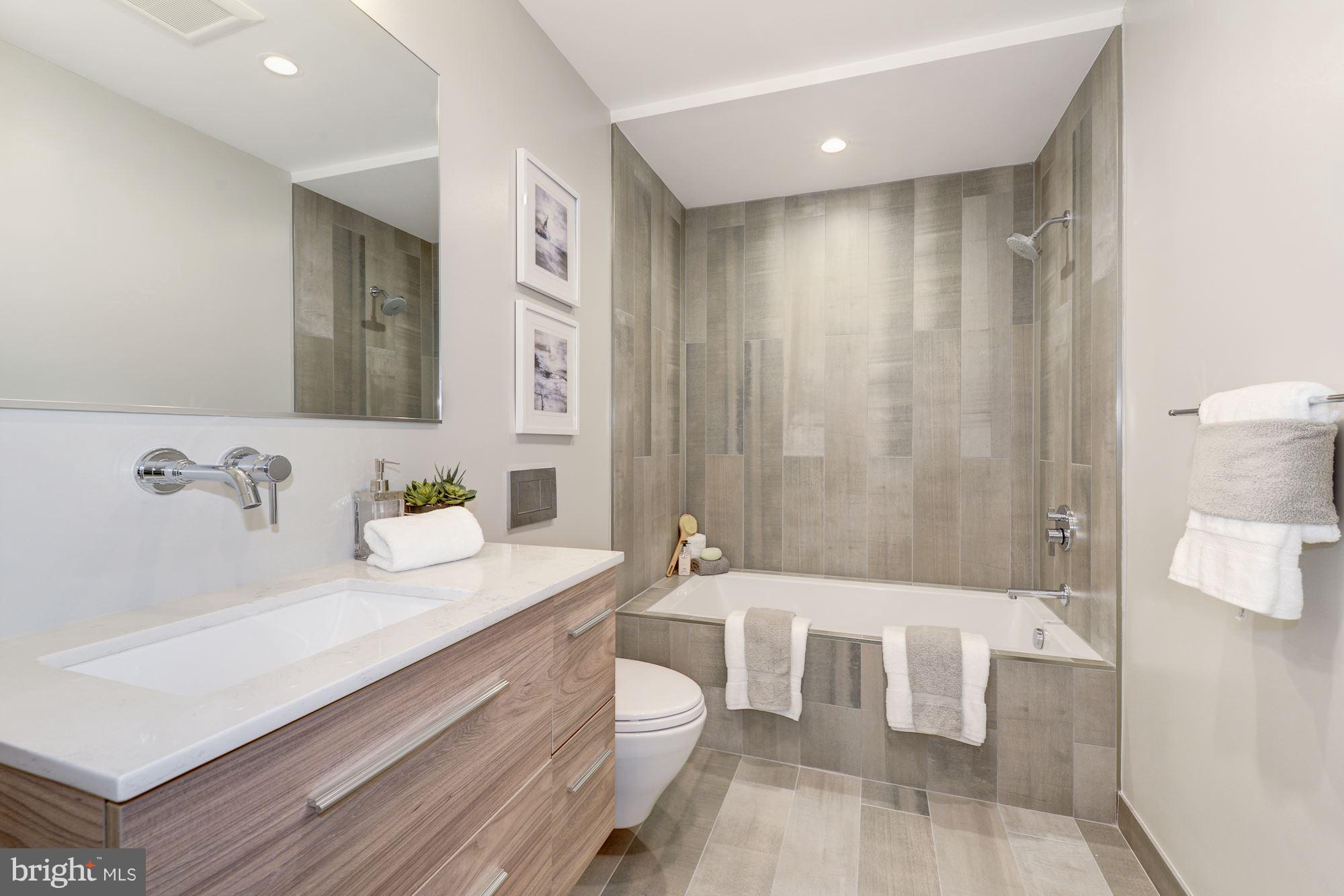 505 K Street Northeast, Unit 2 Washington, DC 20002 - Photo 16 of 18 a spacious bathroom with a bathtub sink and toilet