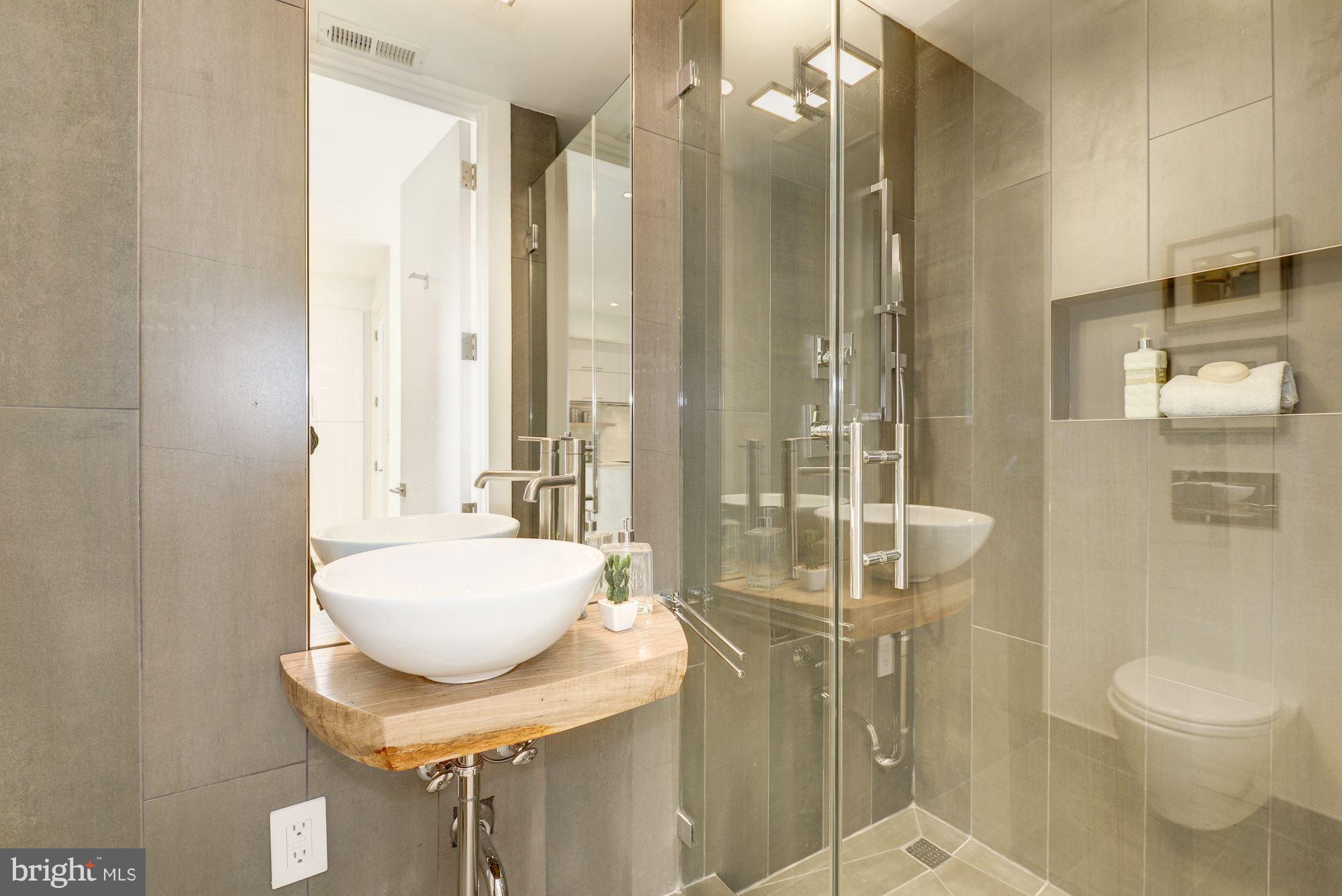 505 K Street Northeast, Unit 2 Washington, DC 20002 - Photo 17 of 18 a bathroom with a sink toilet and shower