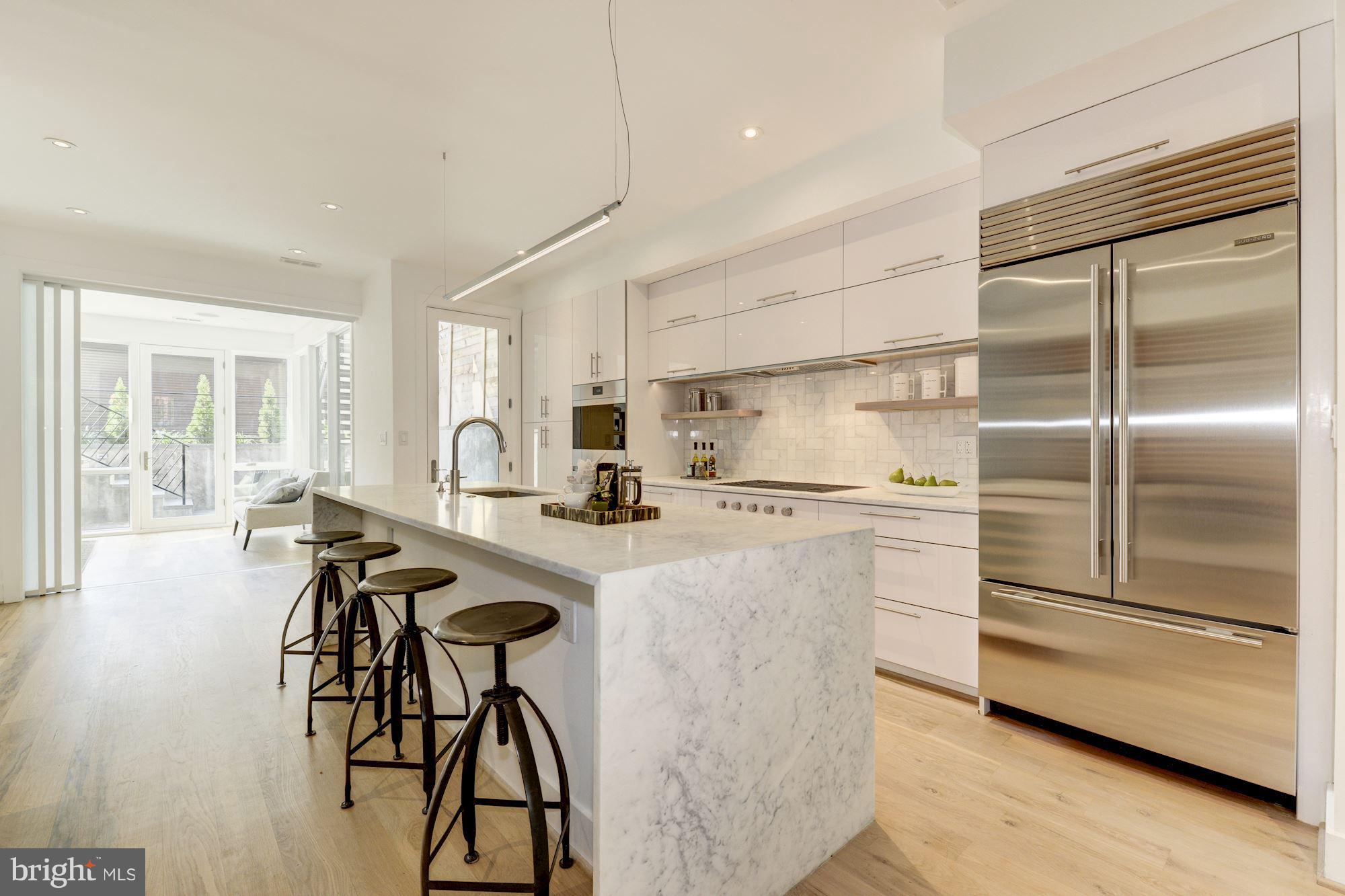 505 K Street Northeast, Unit 2 Washington, DC 20002 - Photo 6 of 18 a kitchen with stainless steel appliances granite countertop a refrigerator and a stove top oven