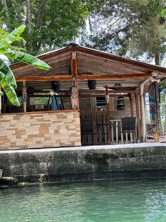 a view of house with swimming pool