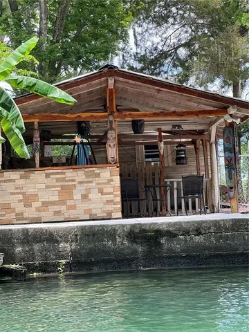 a view of house with swimming pool