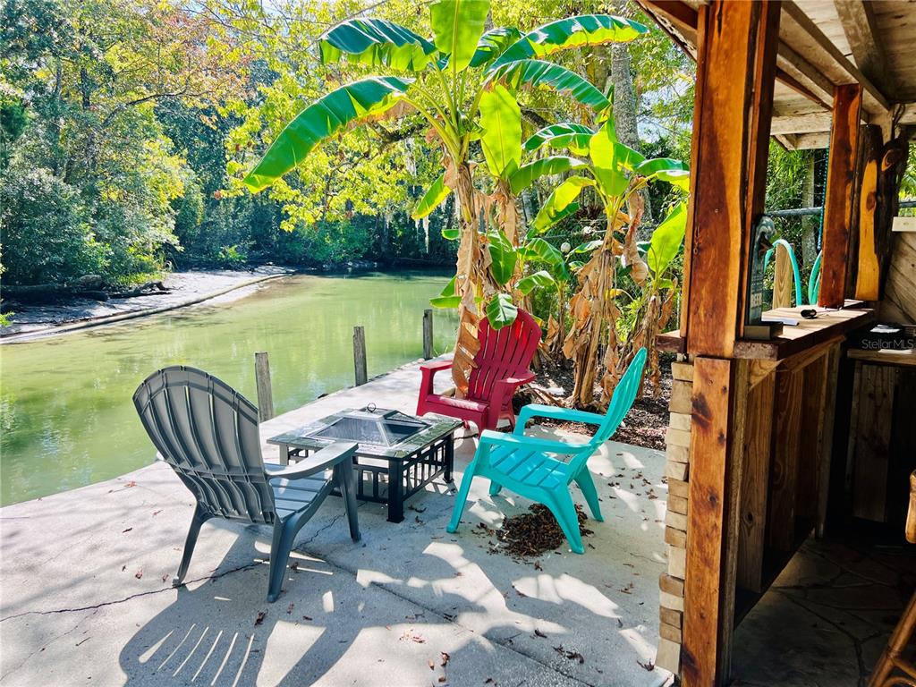 0 Waverly Road Weeki Wachee, FL 34607 - Photo 3 of 10 a view of a two chairs in the patio next to a yard