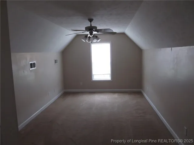 a view of entryway with a fan