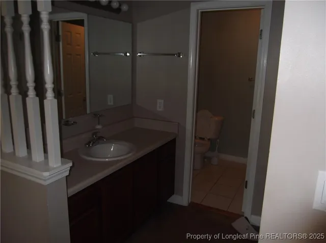 a bathroom with a sink and mirror
