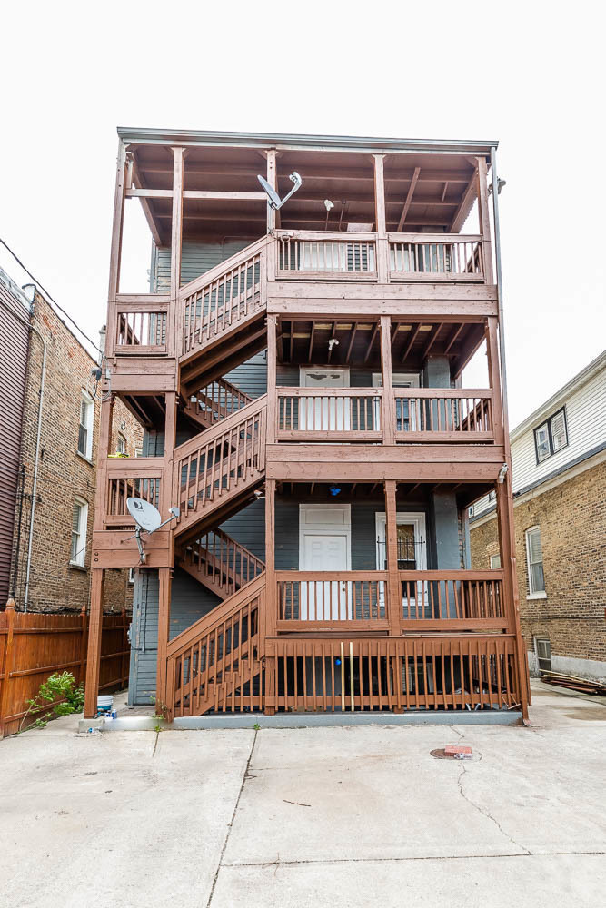 2310 North Kenneth Avenue, Unit 3 Chicago, IL 60639 - Photo 11 of 11 a front view of multi story residential apartment building