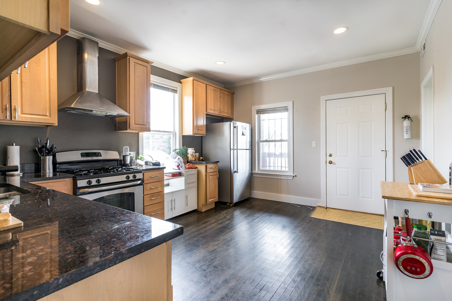 2310 North Kenneth Avenue, Unit 3 Chicago, IL 60639 - Photo 3 of 11 a kitchen with a stove a sink and a refrigerator