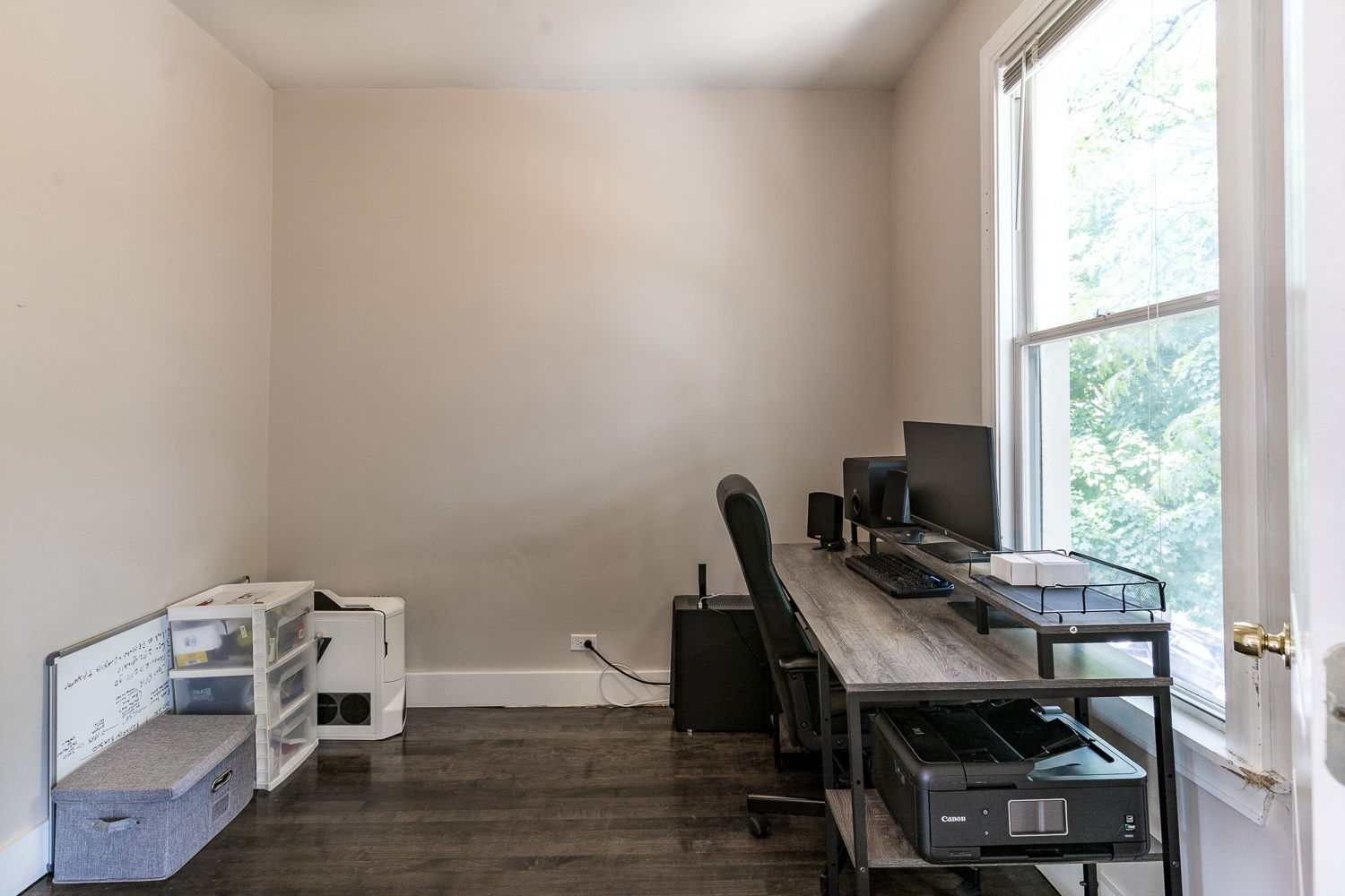 2310 North Kenneth Avenue, Unit 3 Chicago, IL 60639 - Photo 8 of 11 a view of a workspace with furniture and a window