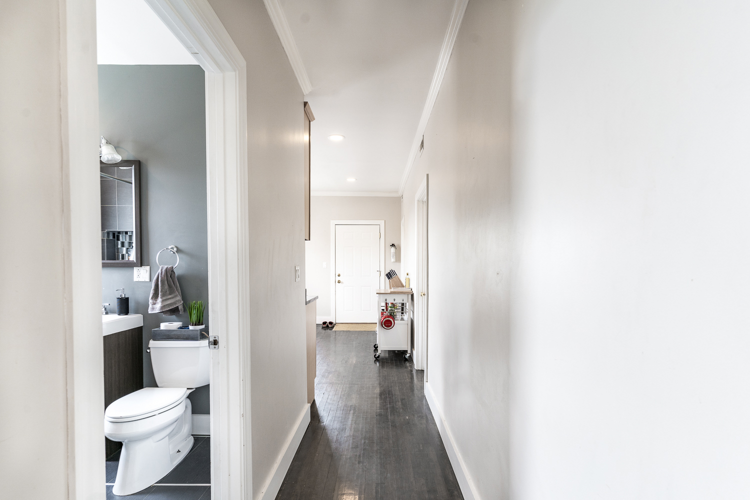 2310 North Kenneth Avenue, Unit 3 Chicago, IL 60639 - Photo 9 of 11 a bathroom with a sink and a toilet
