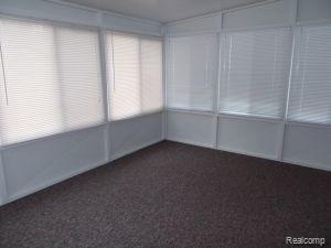 2964 North Lakeshore Road Port Hope, MI 48468 - Photo 8 of 10 Sunroom faces the lake.jpg