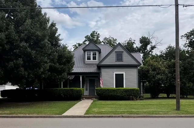 a front view of a house with a yard