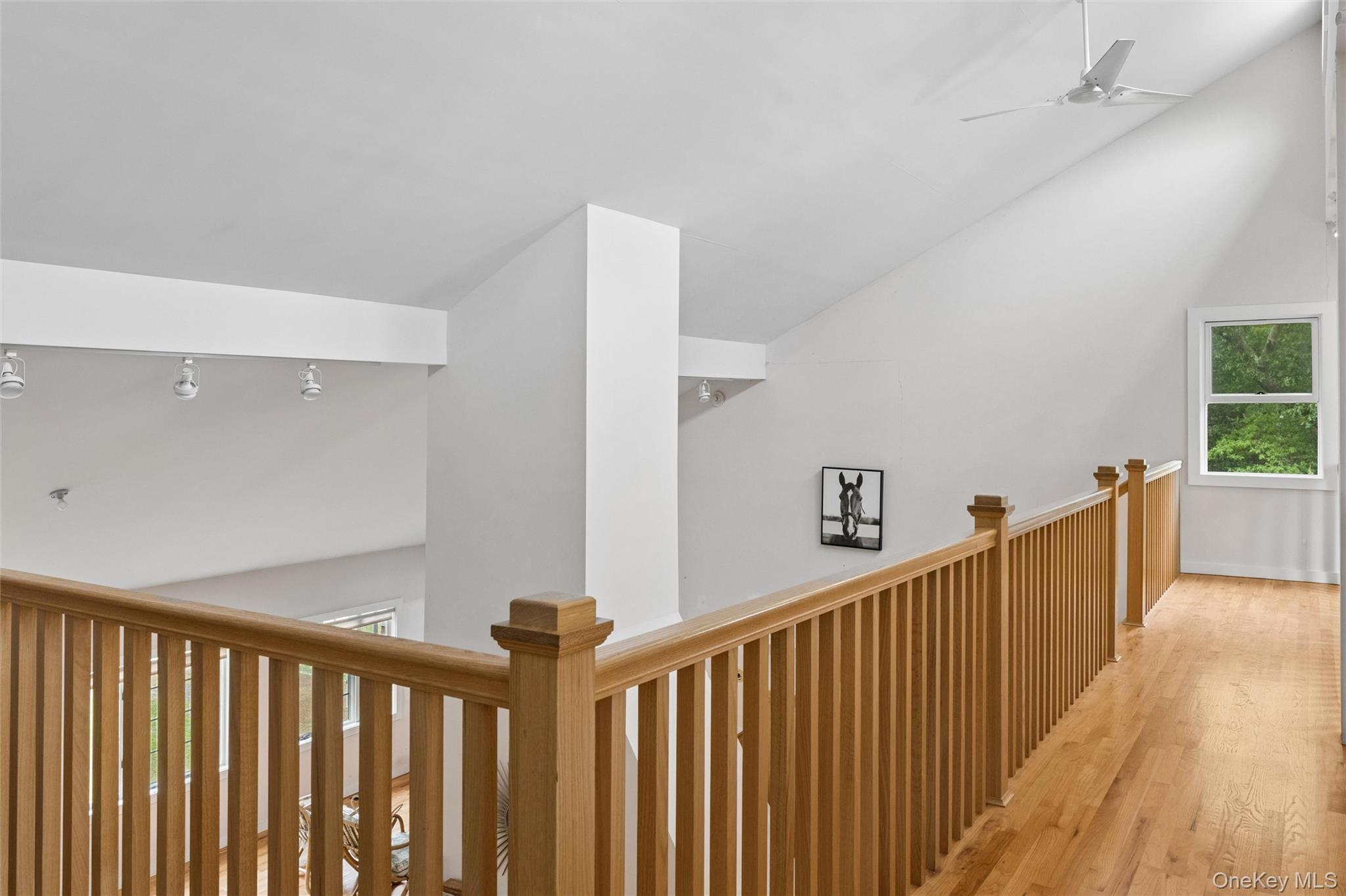 131 Red Creek Road Hampton Bays, NY 11946 - Photo 21 of 35 a view of a hallway with wooden floor