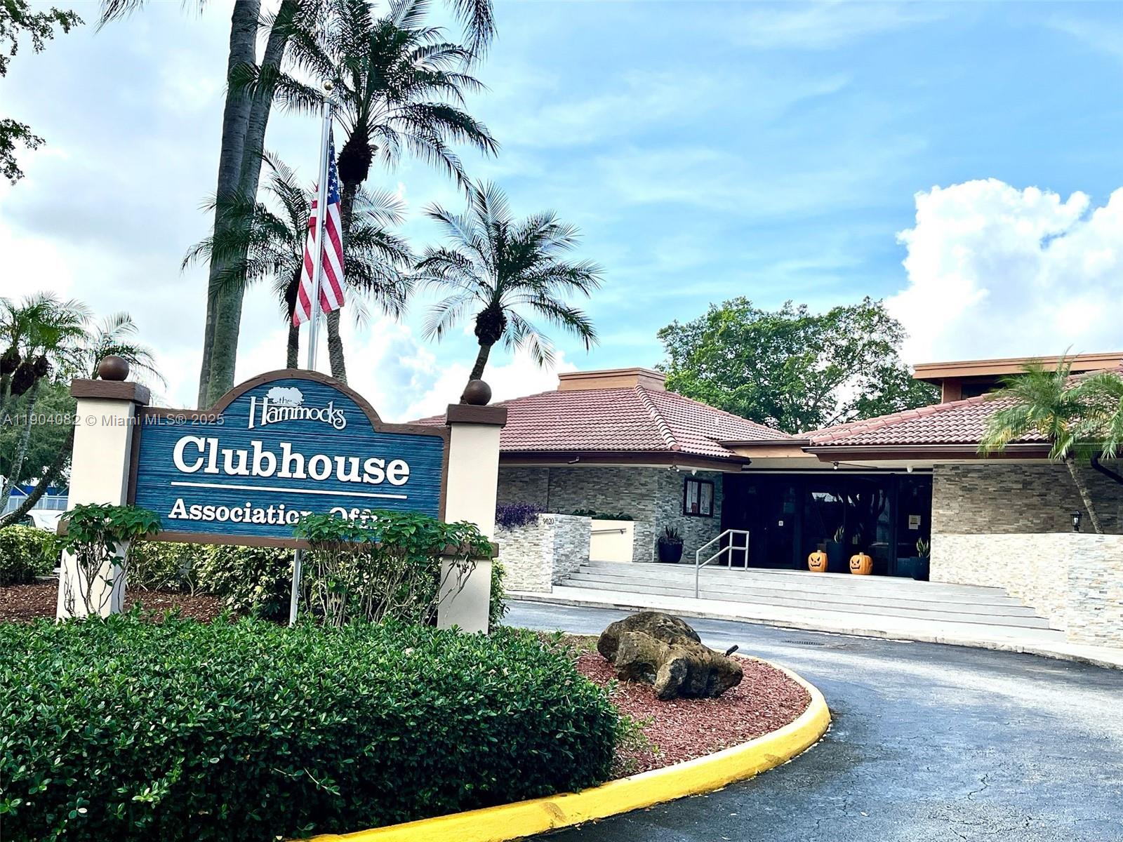 10445 Southwest 154th Court, Unit 2 Miami, FL 33196 - Photo 11 of 11 a view of a house with a yard and a garage
