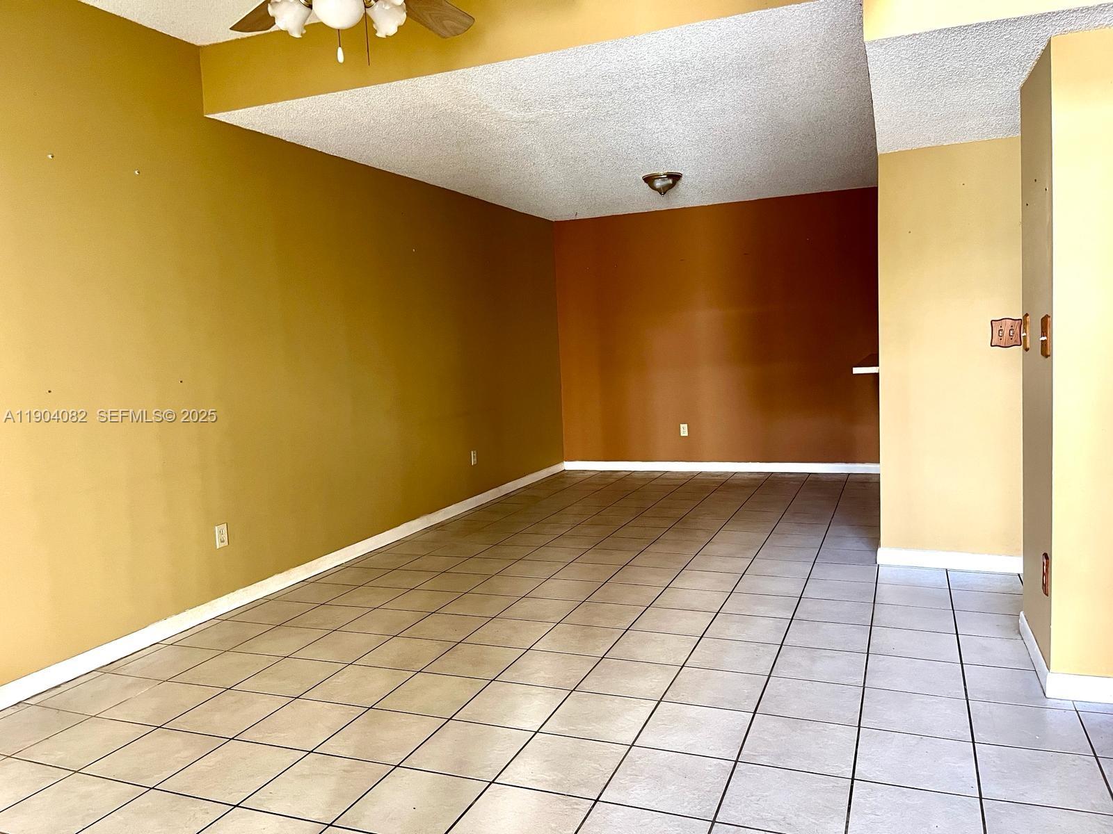 10445 Southwest 154th Court, Unit 2 Miami, FL 33196 - Photo 5 of 11 a view of an empty room