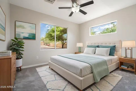 a bedroom with a large bed and a window